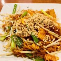 Pad Thai · Delightful chantaboon noodle dish with bean sprouts, green onions and egg, topped with crush...