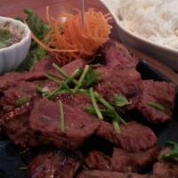 Tiger Cry · Thin slices of tender grilled beef marinated with garlic, pepper and crushed chili and a spe...