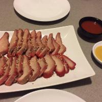 BBQ Pork · Sliced Chinese-style grilled pork served with sesame, house red sauce and hot mustard.