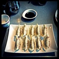 10 Pot Stickers · Steamed and pan-fried dumplings filled with chopped veggies and chicken, served with house p...