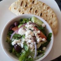 Greek Salad · Fresh romaine lettuce, topped with ripe tomatoes, cucumbers, red onions, Kalamata olives, be...