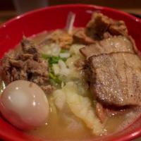Spicy Mega Ramen · wavy noodle in creamy chicken paitan soup .topped with pork or chicken  thats your choice me...
