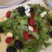 Chopped Salad · Served with black olives, cherry tomatoes and goat cheese.