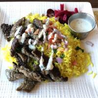 Gyro Plate · Your choice of our classic chicken, beef, or lamb gyro meat served over basmati rice, topped...