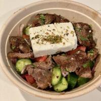 Traditional Greek Salad · No lettuce and no greens. Tomato, cucumber, green pepper, red onion, Kalamata olive, Greek f...