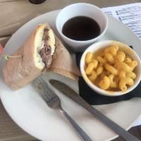 French Dip Sandwich · Roast beef, au jus, horseradish mayo, smoked Gouda, Swiss, and hoagie bun.