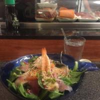 Sashimi Salad · Mixed green salad, tuna, salmon, yellowtail, shrimp with house special soy-sesame dressing.
