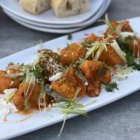 Spicy Buffalo Cauliflower · Fresh cauliflower florets buttermilk-battered and fried to a golden brown, then tossed in ho...