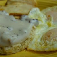 Country Breakfast · 2 fresh biscuits topped with our savory country sausage gravy and 2 eggs any style. Served w...
