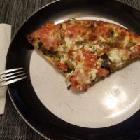 Greek Pizza · Feta cheese, green olives, eggplant, fresh tomatoes, cilantro and extra virgin olive oil. Ol...