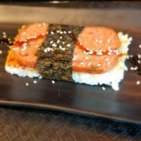 Spam Musubi · Caramelized sweet soy glaze spam and sushi rice with nori wrap.
