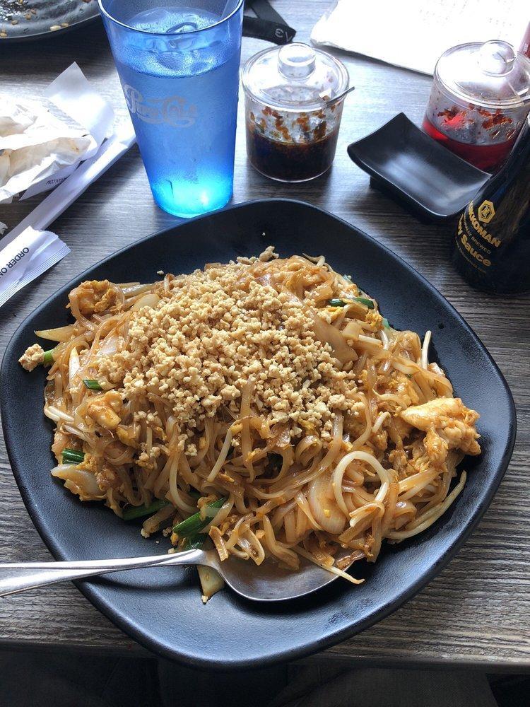 Pad Thai Noodles · Thin rice noodles, egg, bean sprouts, scallions, onions, stir-fried in a tamarind sauce, and tipped with crushed peanuts. (Spicy)