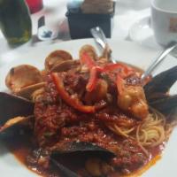 Capellini Alle Scoglie · Clams, mussels and shrimp over capellini served in red or white sauce.