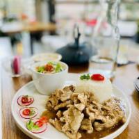 Malaysian Coconut Soup · Coconut meat, galangal, lemongrass, lime-leaf, dry red chili, mushroom with choice of tofu o...