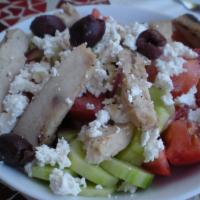 Greek Salad · Tomatoes, cucumbers, lettuce, onions, olives and feta cheese. Vegetarian.