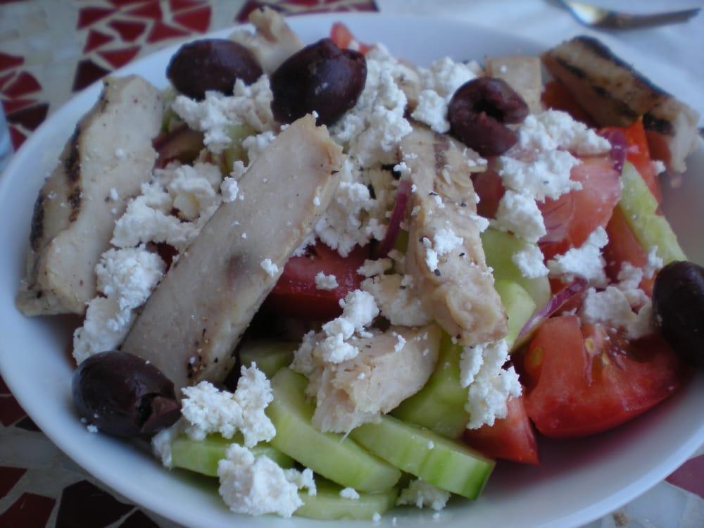 Greek Salad · Tomatoes, cucumbers, lettuce, onions, olives and feta cheese. Vegetarian.