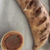 Pepperoni Calzone · Stuffed with pepperoni and mozzarella cheese, served with side of marinara sauce.