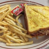 Monte Cristo Sandwich · Ham, turkey, Swiss cheese, and dipped in egg batter.