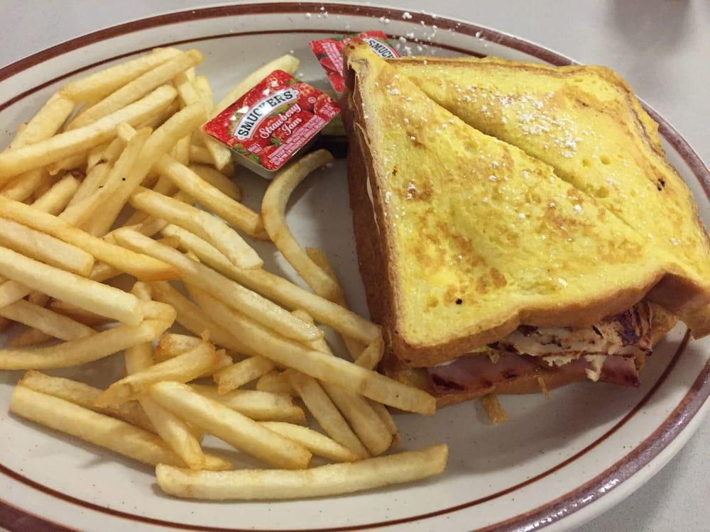Monte Cristo Sandwich · Ham, turkey, Swiss cheese, and dipped in egg batter.