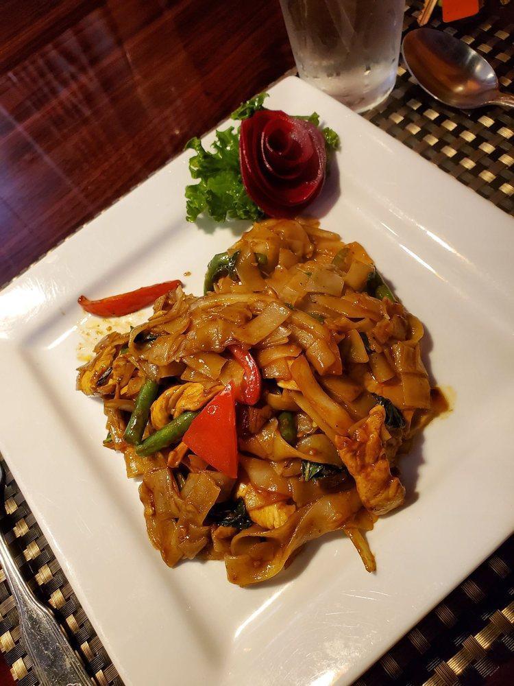 Drunken Noodles · Rice noodles with green bean, eggplant, bell pepper, tomato, onion, and basil leaves.