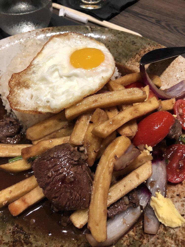 1111 Lomo Saltado · Beef tenderloin sautéed with red onions, tomatoes, french fries and served with white rice topped with fried egg.