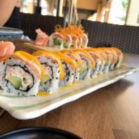 Salmon Acevichado Roll · Nikkei style sushi filled with kani crab salad and avocado topped with thin sliced salmon an...