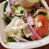 Greek Salad · A blend of iceberg and romaine lettuce with onions, tomatoes, cucumbers, bell pepper, and to...