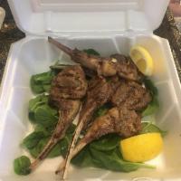 Lamb Chops · 4 frenched lamb chops charbroiled to order.