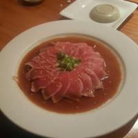 Tuna Tataki · Thin slices of seared tuna served with ponzu sauce. Raw.