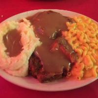 2 Smothered Pork Chops · 2 fried pork chops smothered with gravy and baked in the oven.