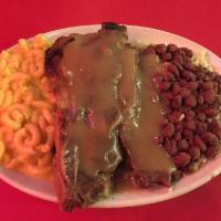 Beef Short Ribs · Oven-baked tender ribs served with gravy.