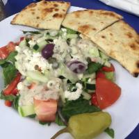 Greek Salad · Fresh cut romaine lettuce with mixed greens, tomato, peppers, olives, onions, cucumber, and ...