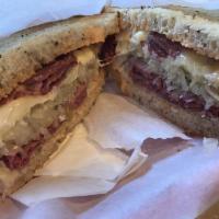 Classic Reuben Sandwich · 1000 island dressing, sauerkraut, corned beef, Swiss cheese and rye bread.