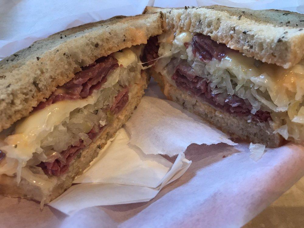 Classic Reuben Sandwich · 1000 island dressing, sauerkraut, corned beef, Swiss cheese and rye bread.
