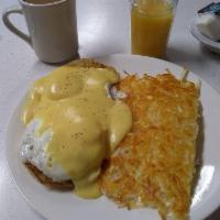 Eggs Benedict · Two basted eggs and Canadian bacon topped with our creamy hollandaise sauce served on an Eng...