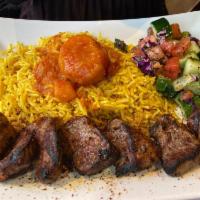Lamb Kabob · Marinated lamb chunks char-broiled with fresh tomatoes, onions and bell peppers. Served with...
