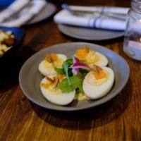 Deep Fried Deviled Eggs · Stuffed eggs, topped with jalapeños, pickled onions, and cilantro