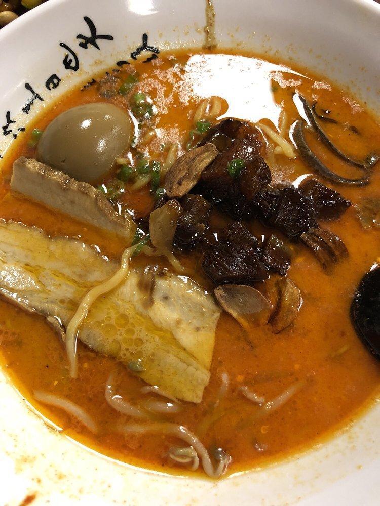 Mayu Garlic Ramen · Pork belly chashu, cubed pork stew, fried garlic, crunchy black mushroom, bean sprouts, green onion.