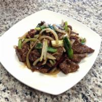 Mongolian Beef · Stir-fried beef with green and white onion. Served with steamed rice. Hot and spicy. 