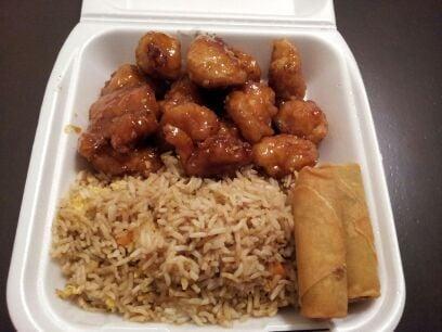 Orange Chicken Combo · Served with steamed rice and two vegetable rolls. 