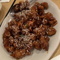 Sesame Chicken · Crispy chicken in our sesame sauce, covered with fresh roasted sesame seeds. Served with ste...