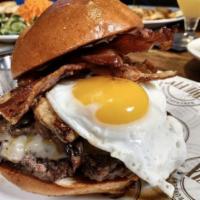The Phenomenal Burger · Bacon, smoked Gouda, fried egg, frizzled onion, sweet chili ranch and brioche roll. Prepared...
