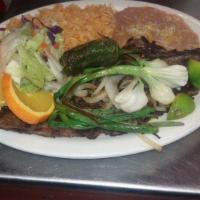 Carne Asada · 8 oz of grill ranchera meat with grill onions, and jalapeno. Served with rice beans , salad ...