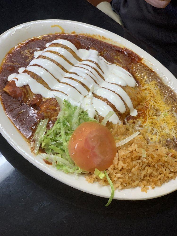 Enchiladas · 3 cheese enchiladas topped of with  Red or green sauce . Served with sour cream , rice and beans . 