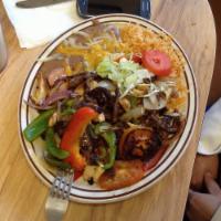Fajitas · Grill chicken , Bell peppers, onions, and tomatoes. Served with rice , beans , guacamole , s...