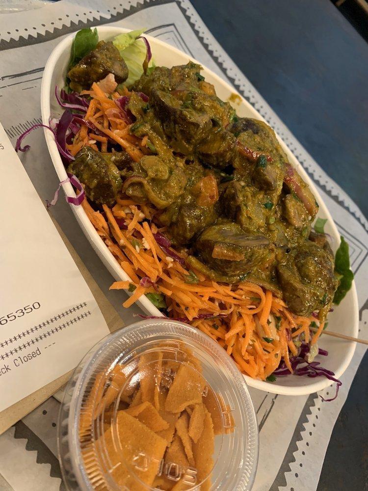 Live Fire Salad · Bowl of romaine lettuce, red cabbage, cilantro, zesty lemon yogurt dressing and fresh mint with choice of main, sauteed with pickled onions, tawa spices, coconut and coriander pestos. Served with chickpea chips. Gluten free.