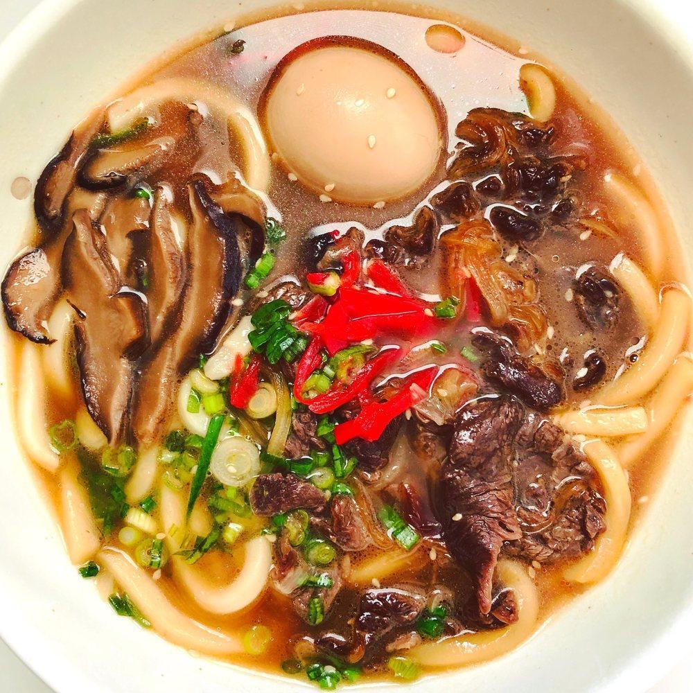 Niku Udon Soup · Udon noodles served hot with ribeye beef, sliced green onions, shiitake mushrooms, pickled ginger and egg (may be raw or undercooked). Pork broth contained fish.