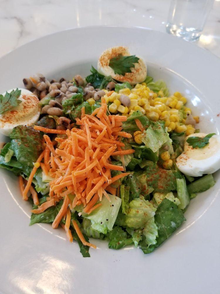 Colleen's Cobb Salad · Romaine, house deviled eggs, red onion, cherry tomatoes, bacon, blue cheese, poppy seed vinaigrette.