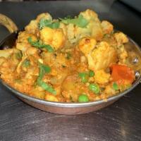 Aloo Gobi · Cauliflower and potatoes cooked with spices. 