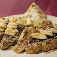 Crunchy Banana French Toast · 2 slices of Texas bread, egg washed and rolled in frosted flakes and cinnamon and sugar. Top...
